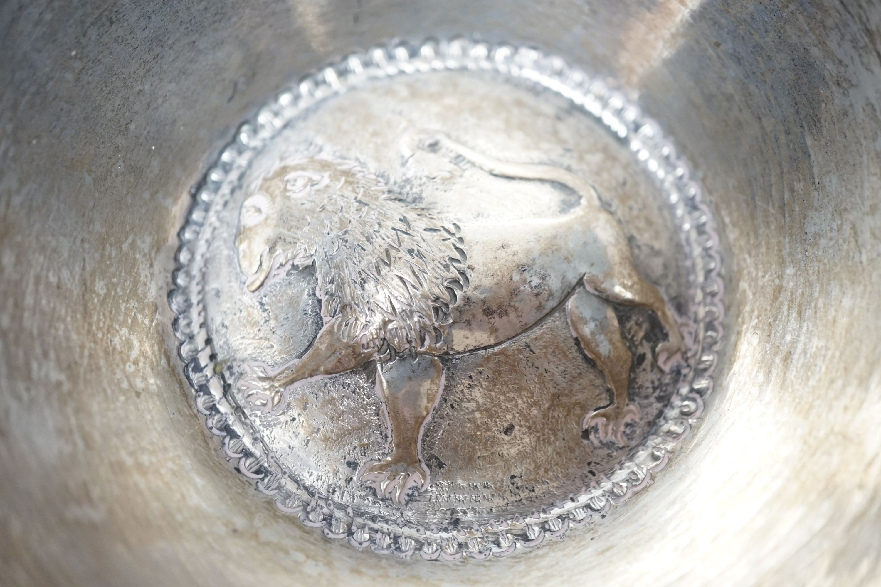 Four small Rangoon white metal bowls together with a simile basket and six small white metal bowls with heraldic motifs, gross 24.5oz.